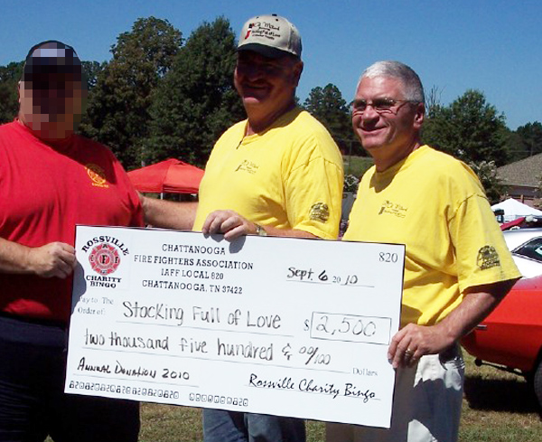 Steve Wilson and Bruce Coker With Check