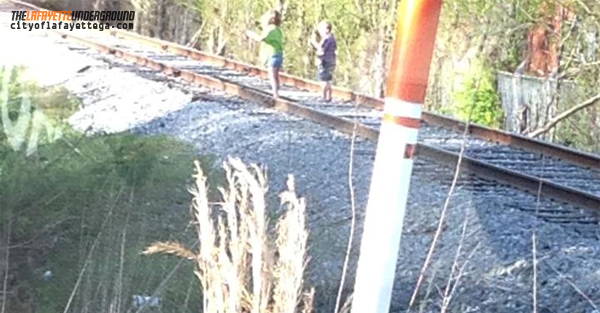 Kids Playing on RR Tracks