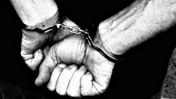 Arrest / Hands in Handcuffs