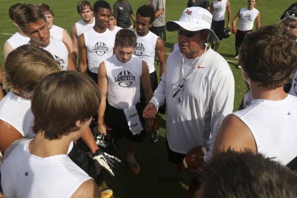 LHS Foot Ball Chad Fisher With Team / Dan Henry Times Free Press